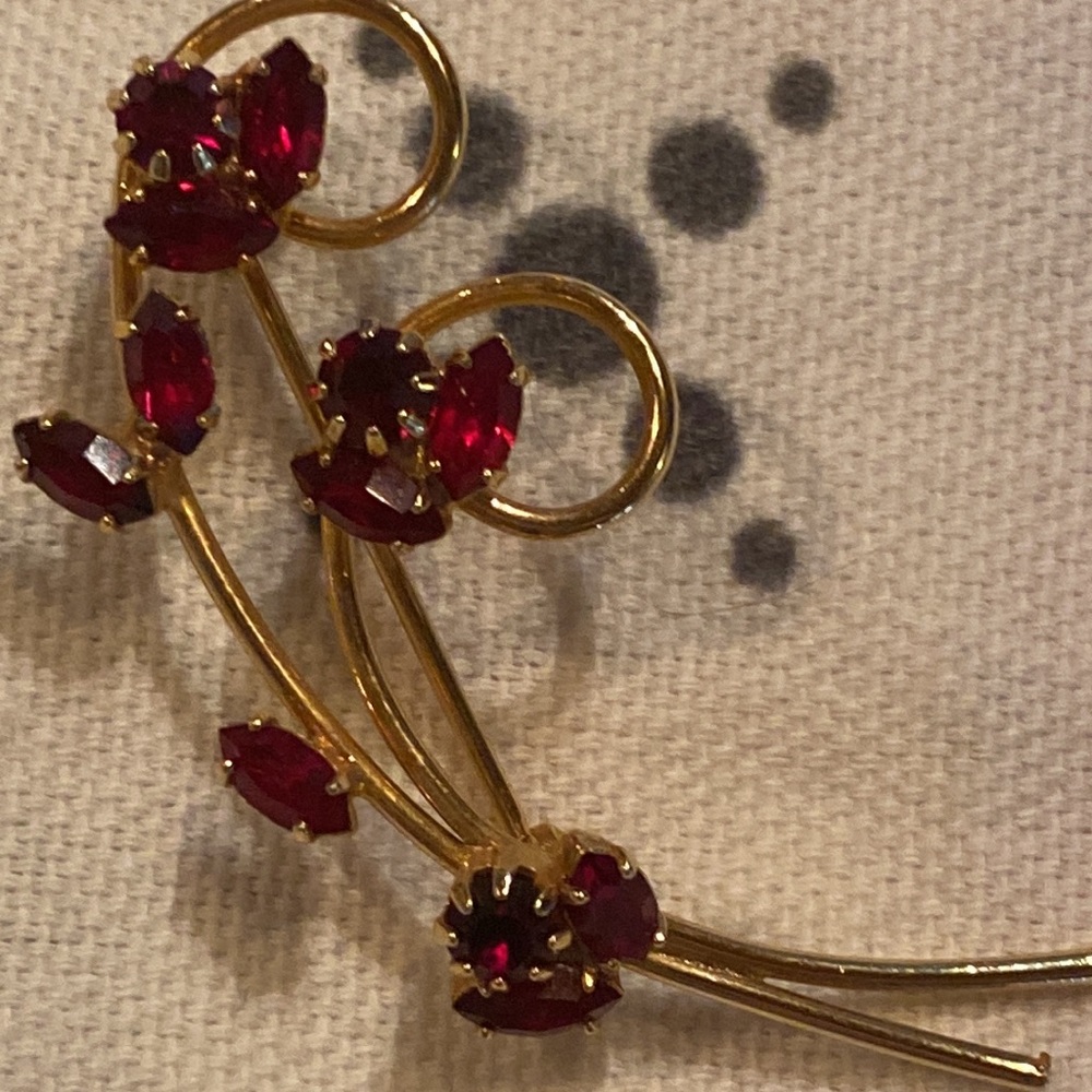 Vintage gold pin with red stones